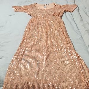Baltic Born gold sparkly dress worn for a wedding party